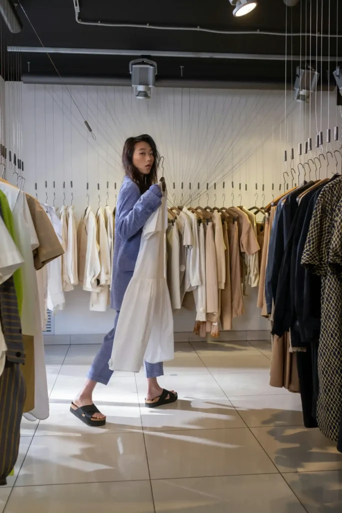 : Close-up of high-quality sustainable fabrics including beige cashmere and white silk.