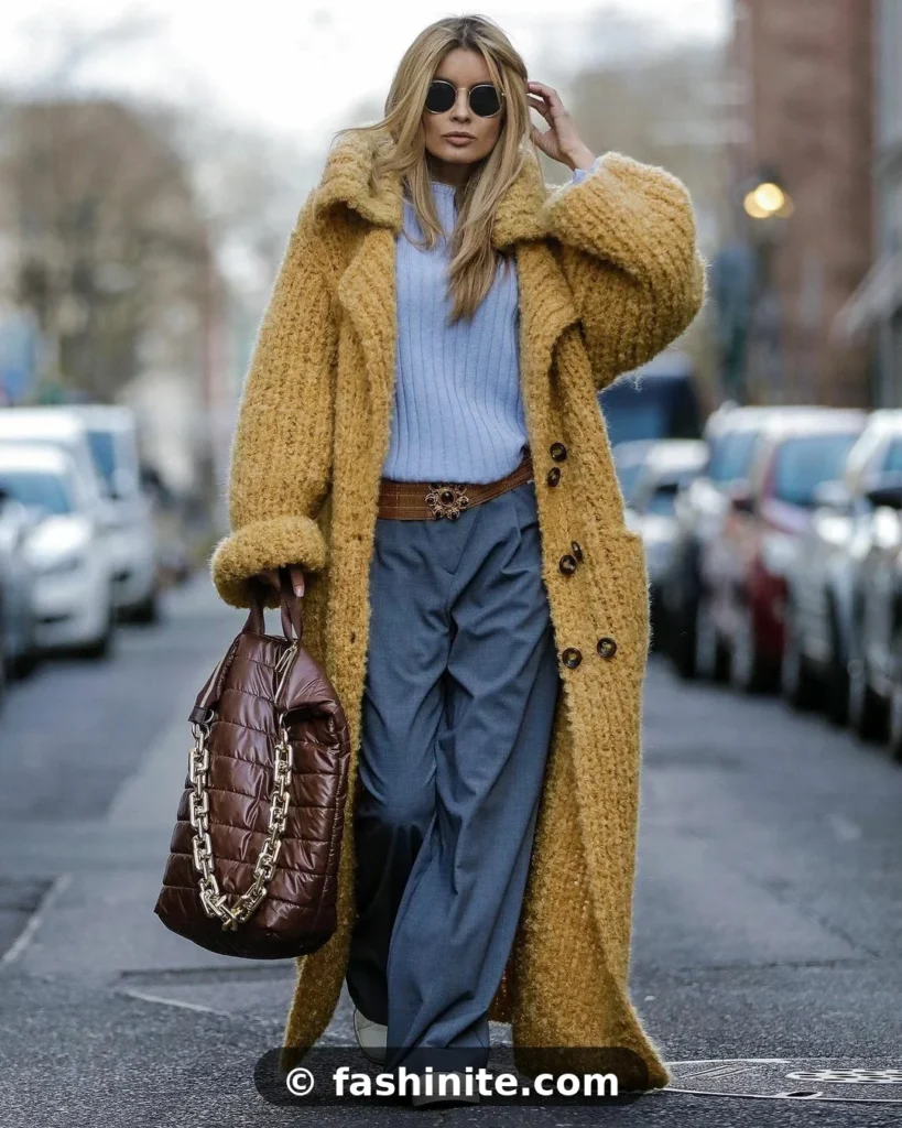 Top Outfits From the Streets of London Fashion Week Woman wearing an oversized camel statement coat — London street style