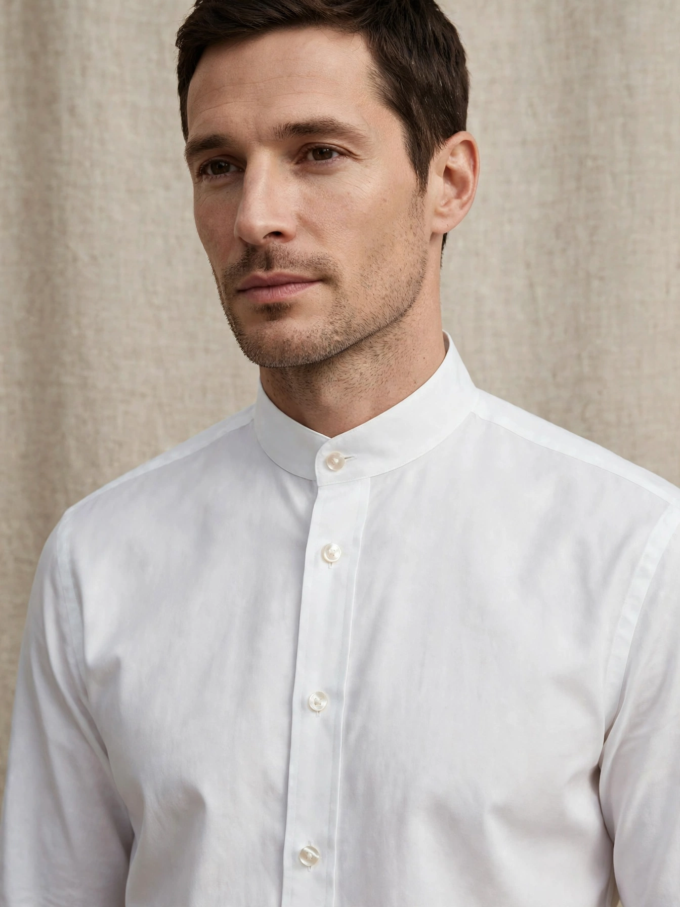 Crisp white button-down shirts in cotton or linen. Look for mother-of-pearl buttons and a collar that stands properly.